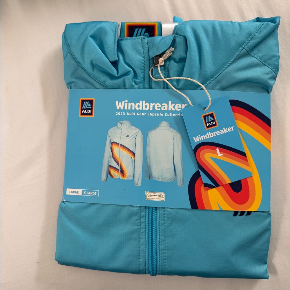 Aldi Blue Windbreaker with Colorful Design
